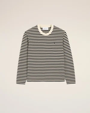 Black-and-white striped long-sleeve knit sweater with a crew neck, displayed against a beige background.