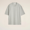 Flat lay of a light gray oversized T-shirt on a beige background, front view with short sleeves.