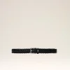 Black braided belt laid flat with a rectangular metal buckle on a pale background, showing its woven texture and loop detail.