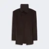 Dark brown open-front coat with a high turtleneck collar and overlapping front panels.