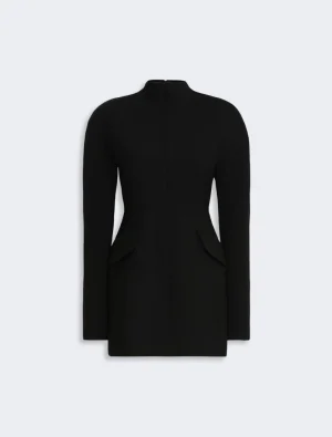 Black tailored long-sleeve coat with a high neckline and front seam, featuring flap pockets at the hips and a clean, minimalist silhouette.