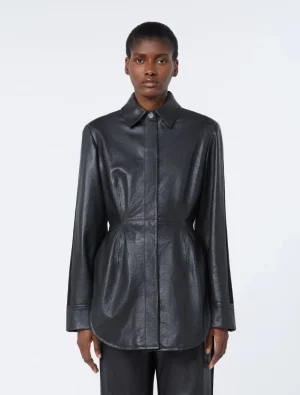 Dark gray leather-like long-sleeve shirt on a model with a collar and curved hem.