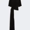 Black draped maxi dress with a twisted waist knot and short sleeves. (Informative product image)