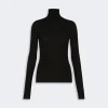Black ribbed turtleneck sweater with long sleeves, form-fitting silhouette and crew neckline (turtleneck)