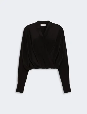 Black wrap blouse with V-neck, long sleeves, and gathered waist