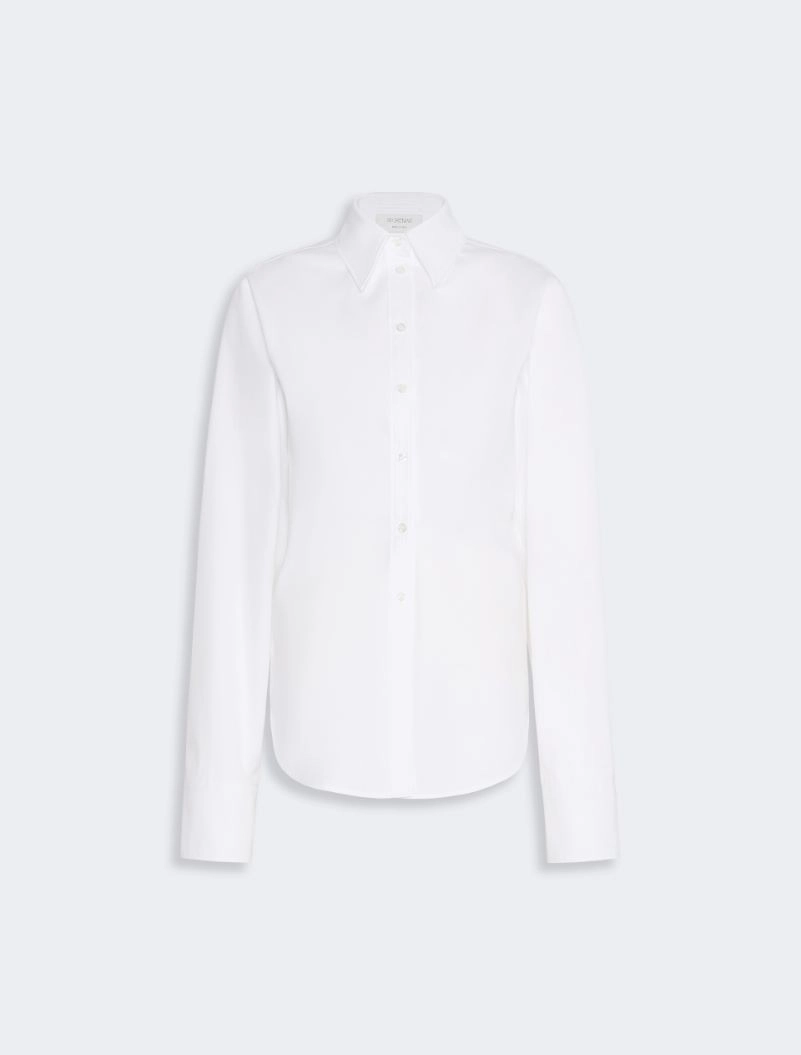 IMG_3812 - New Trend White button-down shirt with long sleeves and curved hem, on a light background (product image).