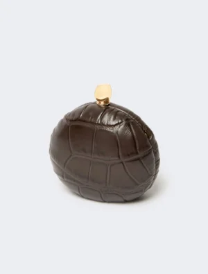Brown crocodile-patterned spherical clutch with a small gold clasp on top, accessory bag for evenings.