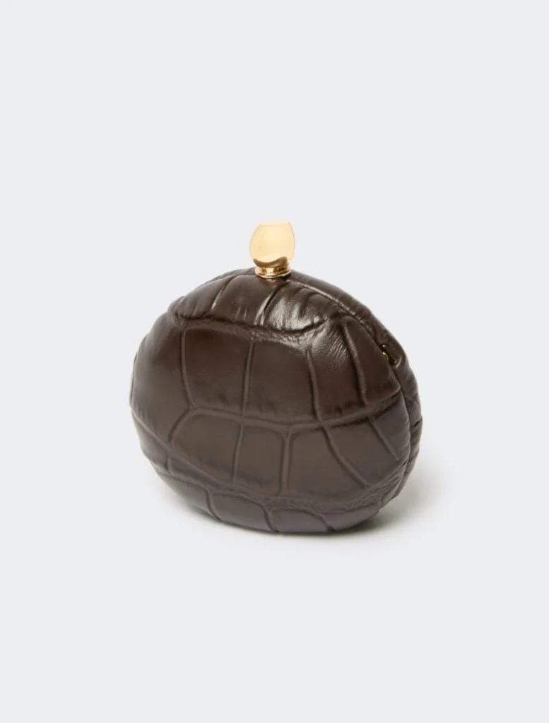 Brown crocodile-patterned spherical clutch with a small gold clasp on top, accessory bag for evenings.
