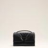 Image 108 - New Trend Black leather handbag with a heart-shaped clasp displayed on a pale studio background.