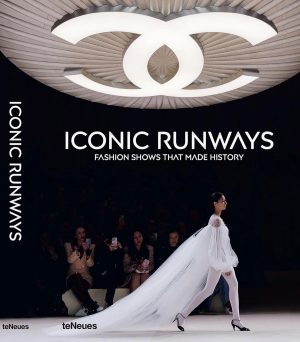 Poster for Iconic Runways fashion show; a model in a dramatic white gown with a long train walks the runway while the audience watches.