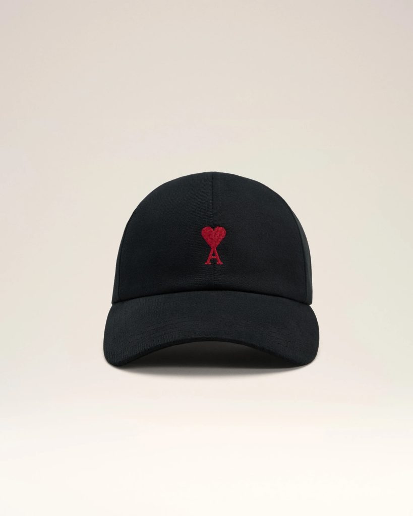 Front view of a black baseball cap with a red heart and letter A embroidered on the front panel.