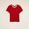 Red short-sleeve T-shirt with cream trim at the collar and cuffs, featuring a small white heart-and-A logo on the left chest against a light background.