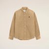 Image 171 - New Trend Beige corduroy button-down shirt with white buttons and a small black heart logo on the left chest against a pale background.