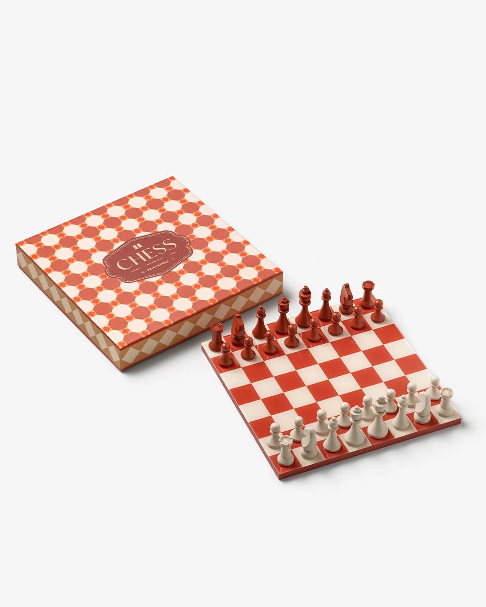Image 184 - New Trend Red and white chess set on a checkered board beside a patterned box.