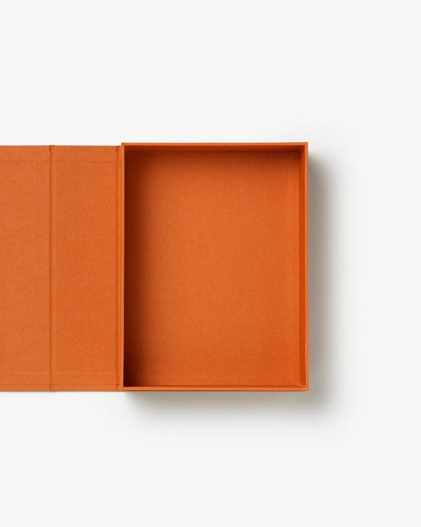 Orange rectangular box with its lid open, showing an empty interior on a white background.