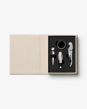 Beige box open to reveal a stainless steel wine accessory set: stopper, pourer, aerator, and corkscrew.