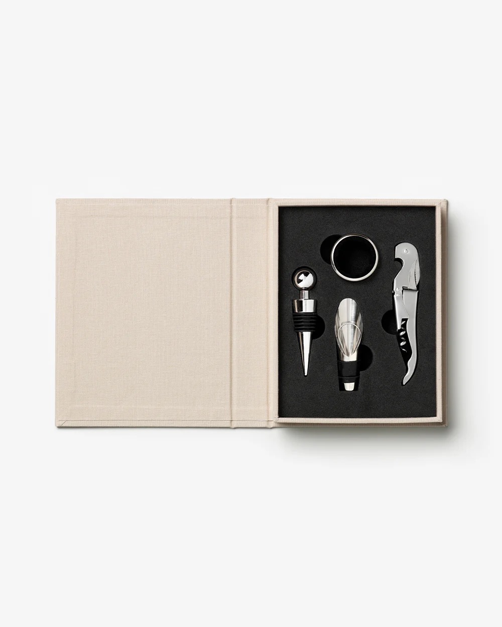 Image 198 - New Trend Beige box open to reveal a stainless steel wine accessory set: stopper, pourer, aerator, and corkscrew.