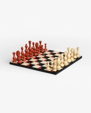 Perspective view of a chessboard with red pieces on the left and cream pieces on the right, ready for a game.