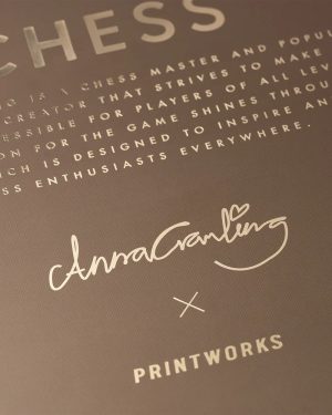 Close-up of a printed surface showing a handwritten signature 'AnnaGarling' with a heart, an 'X' mark, and the word 'PRINTWORKS' beneath.