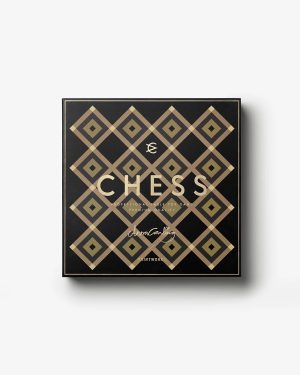 Black square box with a gold diamond lattice pattern, featuring the large word CHESS and a signature at the bottom.