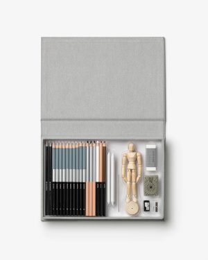 Open gray art-case showing colored pencils, drawing tools, a wooden mannequin, and small accessories for drawing and modeling.