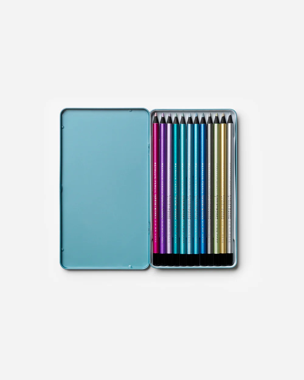 Image 246 - New Trend Open metal tin containing 12 colorful drawing pencils arranged in a rainbow spectrum inside a blue case.