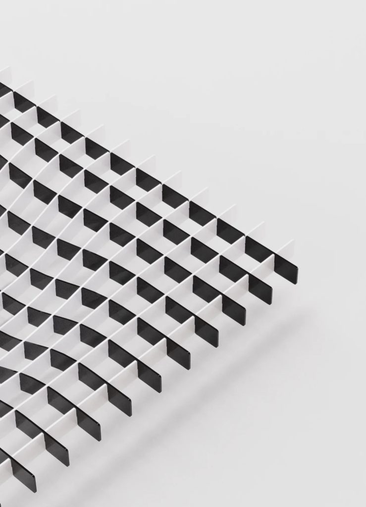 Abstract black-and-white diagonal chevron pattern forming a stair-step grid across the frame