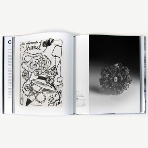 Open art book showing a black-and-white doodle on the left page and a grayscale bead sculpture on the right page; left features a hat, flowers, and chain-like lines, right shows a clustered spherical bead form against a gradient background.