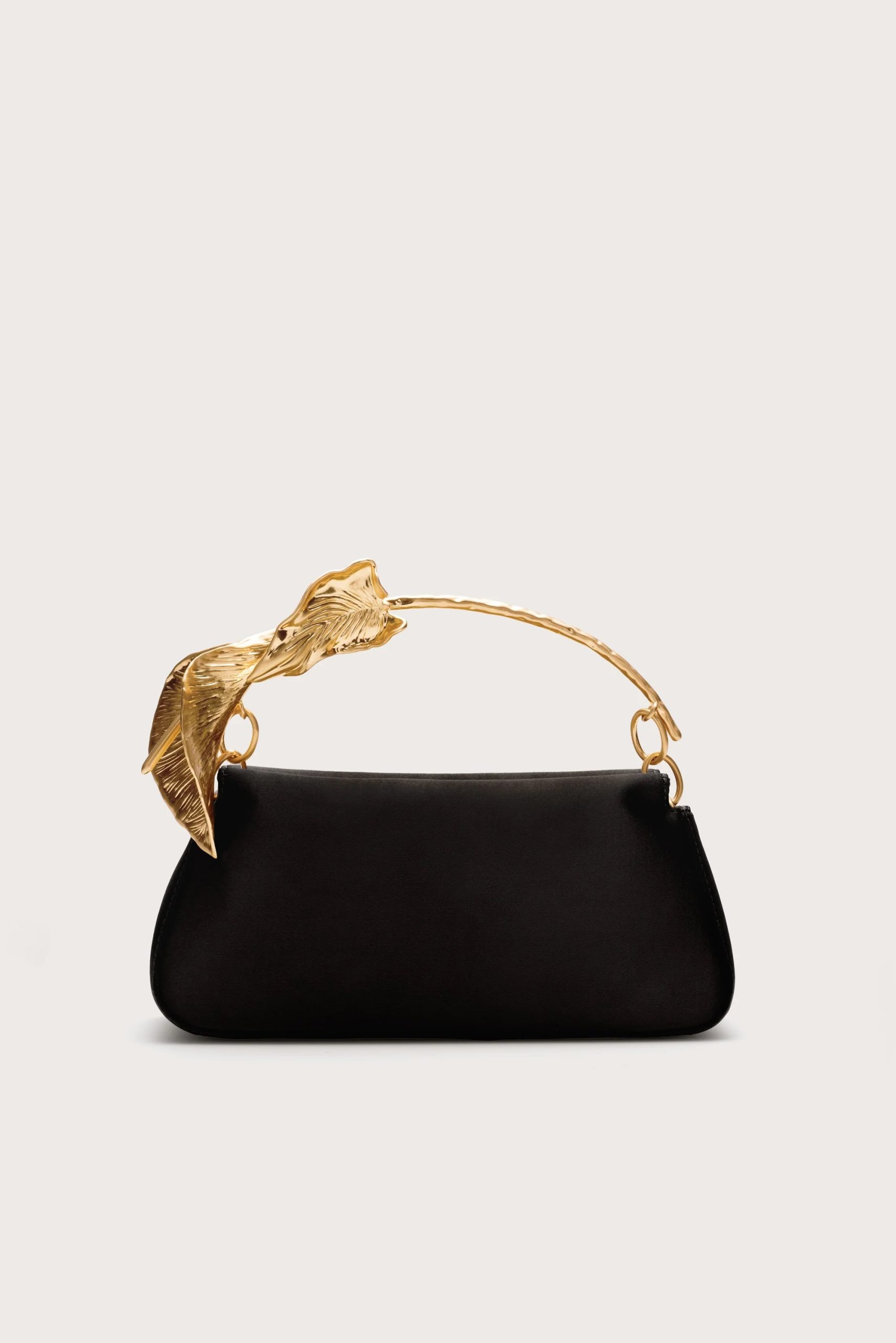 Image 423 - New Trend Black handbag with a gold-tone branch/leaf-shaped handle against a light background, product shot for fashion accessory.