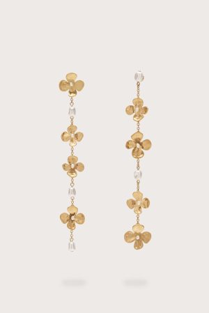Gold-tone drop earrings with alternating flower charms and small white beads on a delicate chain, shown against a light background.