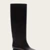 Image 485 - New Trend Black knee-high leather boot with a chunky heel photographed against a light beige background, side view