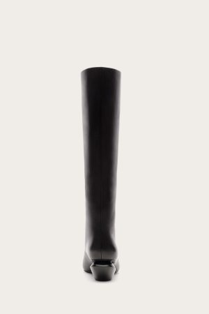 Back view of a tall black leather boot standing upright against a light background, showing the shaft and heel.led