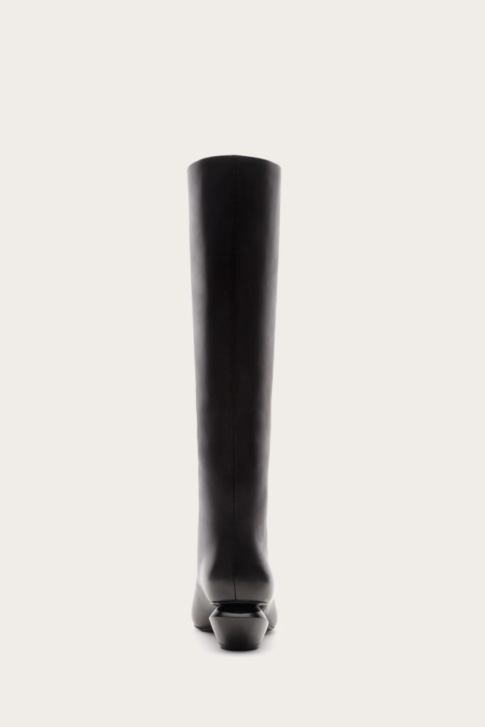 Back view of a tall black leather boot standing upright against a light background, showing the shaft and heel.led