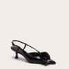 Image 489 - New Trend Black strappy high-heeled sandal with a thin ankle strap on a light beige background