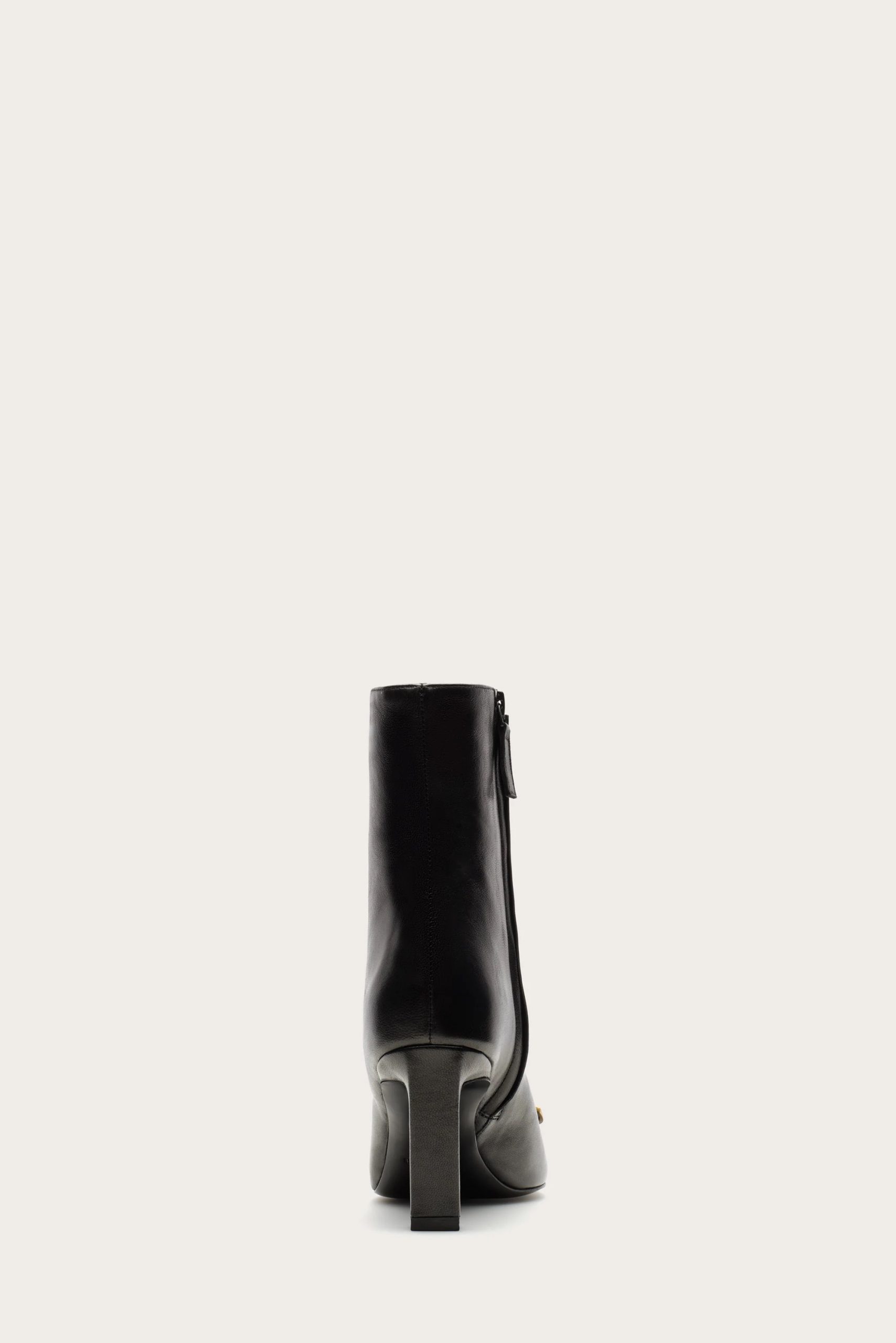Image 517 - New Trend Back view of a black leather knee-high boot with a chunky heel.