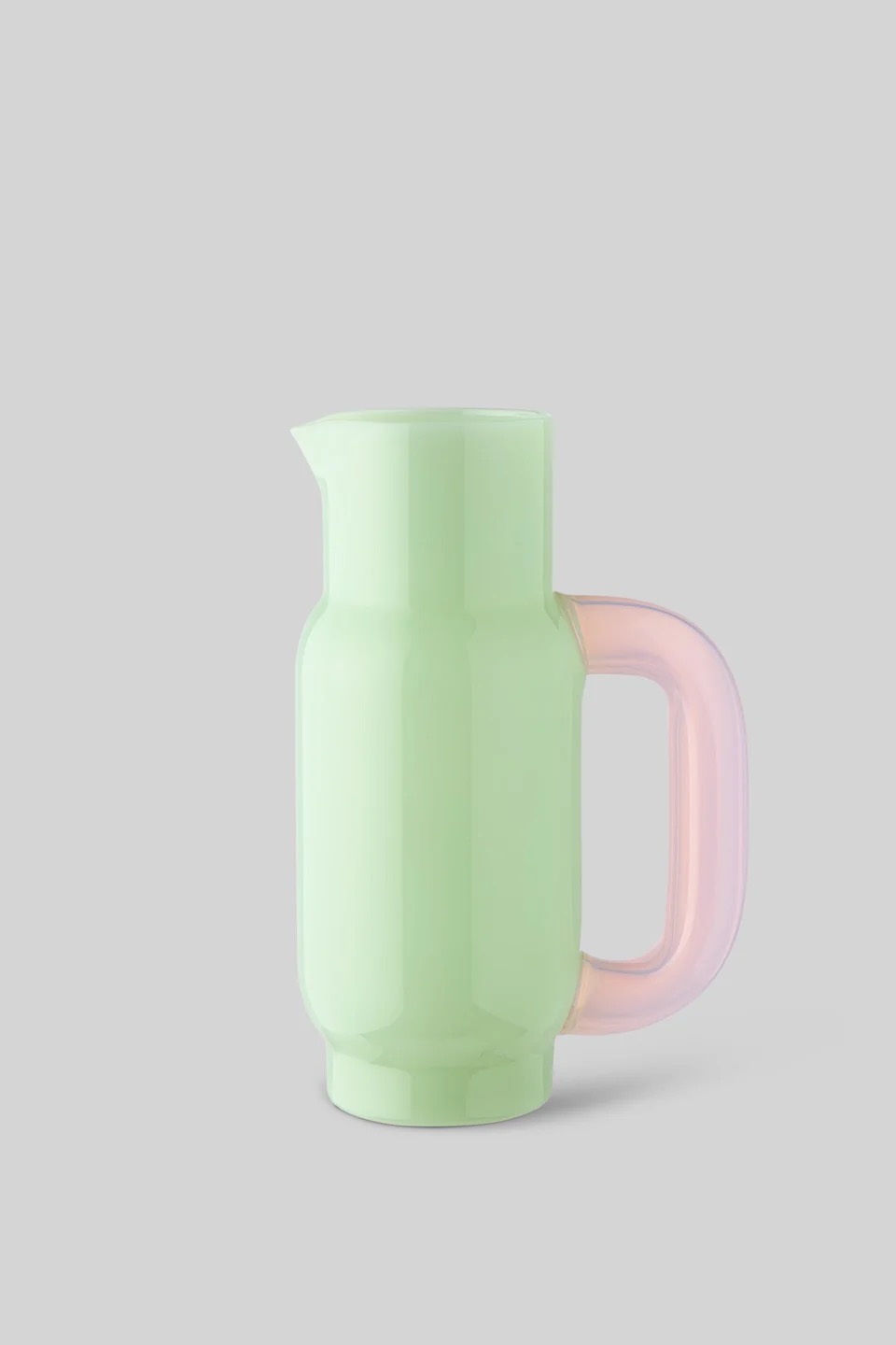 Image 578 - New Trend Pastel green pitcher with a pink translucent handle on a gray background for pouring drinks.
