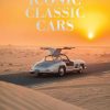 Image 8 - New Trend Book cover showing a silver classic car with gull-wing doors on a desert road at sunset, titled 'Iconic Classic Cars'.