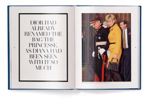Open book with a framed quote on the left page and a photo of Princess Diana in a yellow suit on the right, carrying a black handbag.