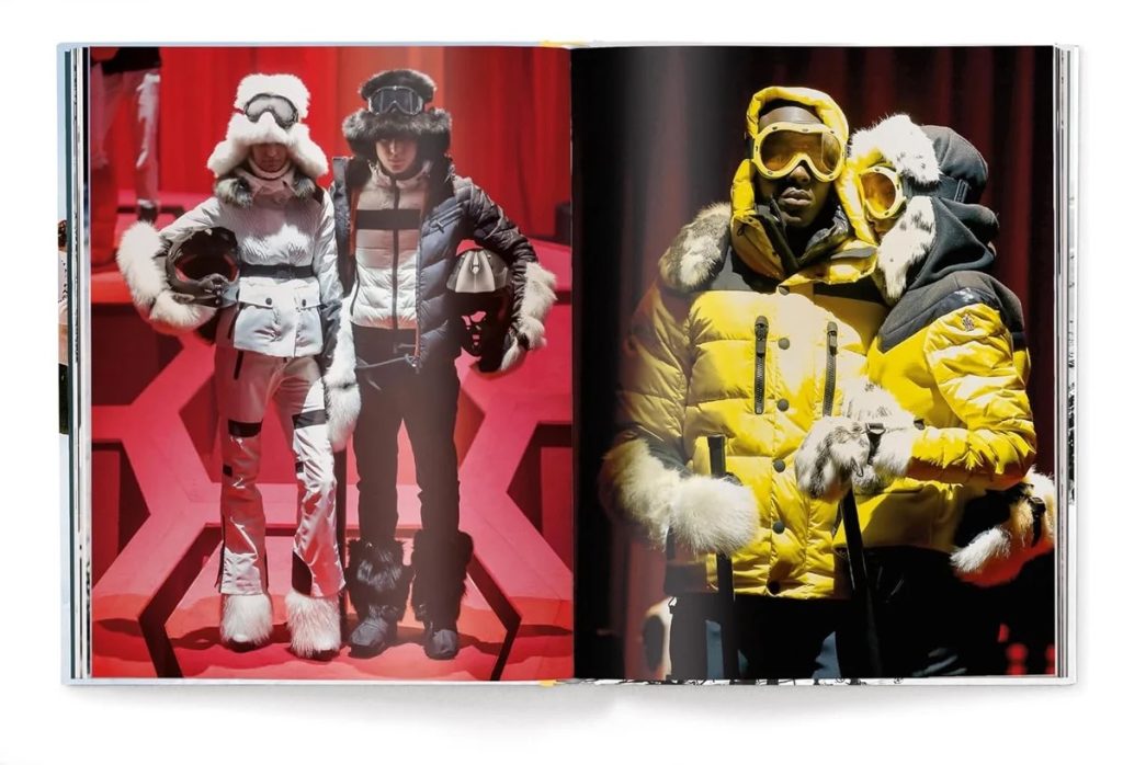 Two models wearing fur-trimmed winter outfits pose on a red set on the left page, while two others in bright yellow puffer jackets with fur trim stand on the right page inside a fashion magazine spread.