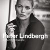 Black-and-white portrait of a fashion photographer holding a cigarette, overlaid with bold title text and 'TASCHEN' at the bottom, indicating a book cover.