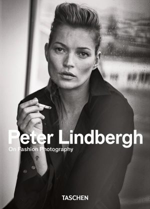 Black-and-white portrait of a fashion photographer holding a cigarette, overlaid with bold title text and 'TASCHEN' at the bottom, indicating a book cover.