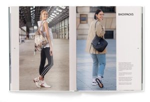 Two-page magazine spread featuring a woman wearing a beige backpack in an industrial setting (left) and a woman with a black quilted handbag and tan coat in an urban scene (right).